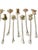 Striking and highly collectible, this vintage set of 11 cocktail picks features abstract organic toppers inlaid with...