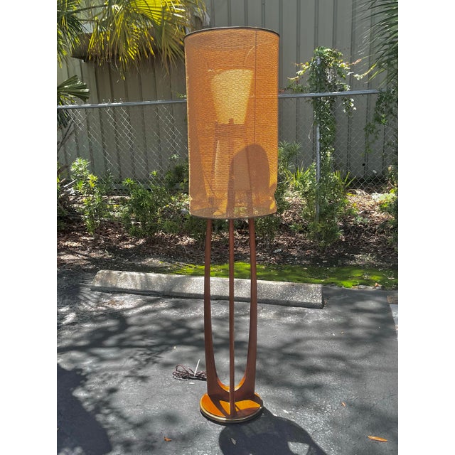 Mid-century modern ‘Cactus’ floor lamp with carved wood by Modeline. A sleek silhouette with a stunning base and hourglass...