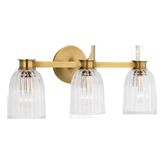 AERIN for Visual Comfort Signature Asalea Triple Vanity Light in Hand-Rubbed Antique Brass with Clear Glass For Sale