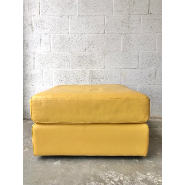 Beautiful Contemporary Leather Ottoman With Casters. In Bright Yellow Leather, this eye catching Ottoman will be the...