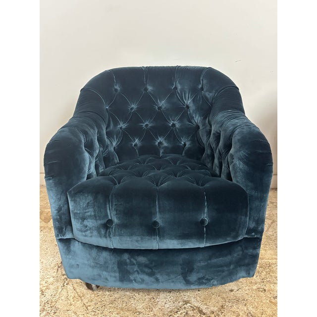 Pair of Ward Bennett tufted club chairs in a beautiful deep blue color. Barrel back his & hers lounge chairs. The chair...