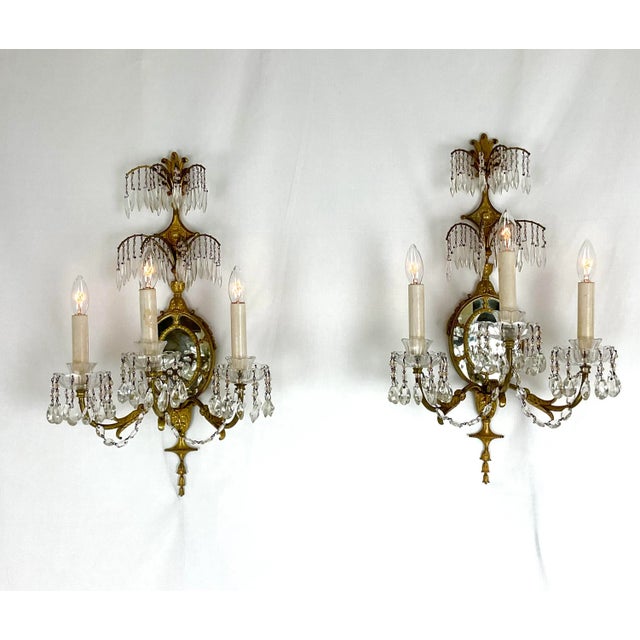 Add timeless elegance and Parisian charm to your space with this exquisite pair of vintage French-style wall sconces....