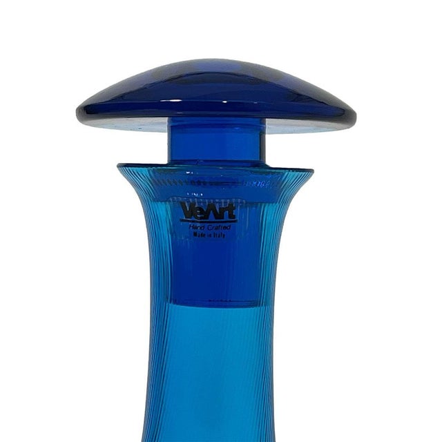 Veart Vetreria, Italian blue glass decanter, 1980s A blue carafe/ decanter, made of glass with a swirl pattern. Made in...