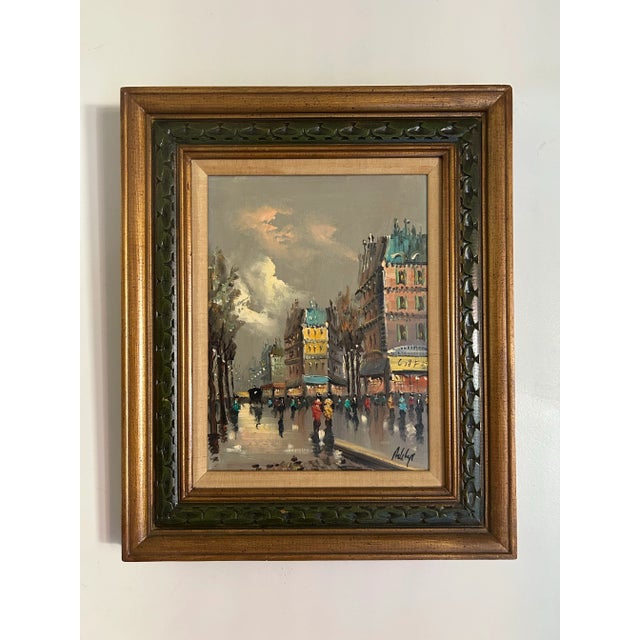 Vintage 1960’s Paris street scene oil painting on canvas in vintage wood frame. Signed to the lower right corner. Great...
