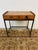Design Plus Gallery presents a Petite Writing Desk with a Vintage + Rustic Style. The wood looks salvaged and has a medium...