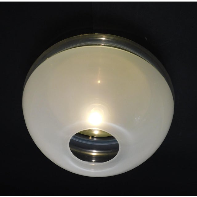 Vintage Italian flush mount or wall light with frosted donut shaped plexiglass shade / Made in Italy by iGuzzini, circa...