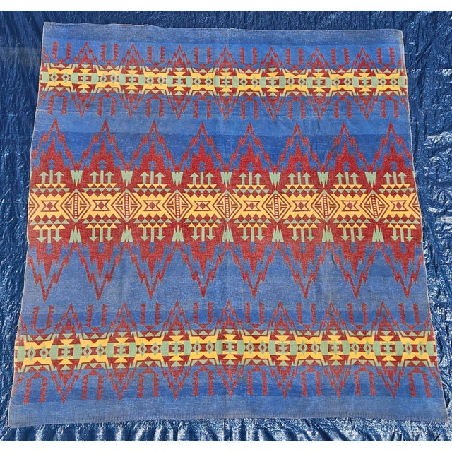 Add a touch of lodge-inspired warmth to your home with this vibrant vintage Southwestern camp and trade blanket. Featuring...