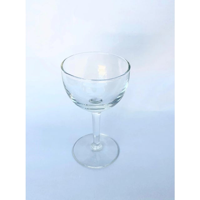 Set of 7 vintage cordial glasses. Clear glass, minimalist design. Each glass holds 4 ounces. No visible maker's mark. Very...