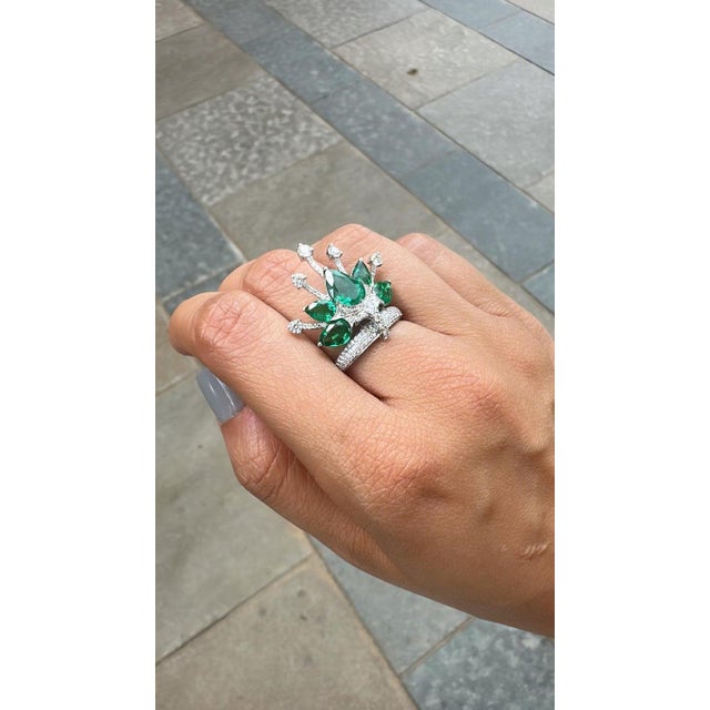 A very gorgeous and beautiful, one of a kind, Emerald Cocktail Ring set in 18K White Gold & natural Diamonds. The weight...