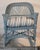 Bar Harbor wicker rocker with blue paint over the original mustard paint. Stripped custom made seat cushion
