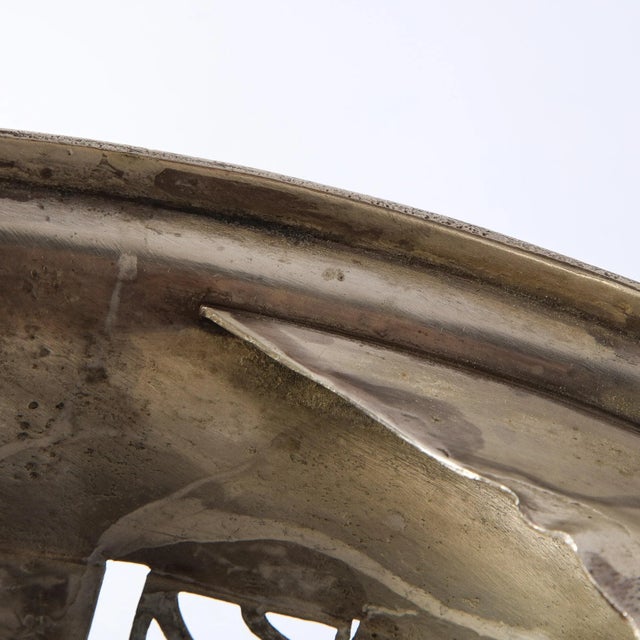 This elegant Art Deco silverplate center piece was realized by the esteemed atelier of WMF Ikora in Germany circa 1925....