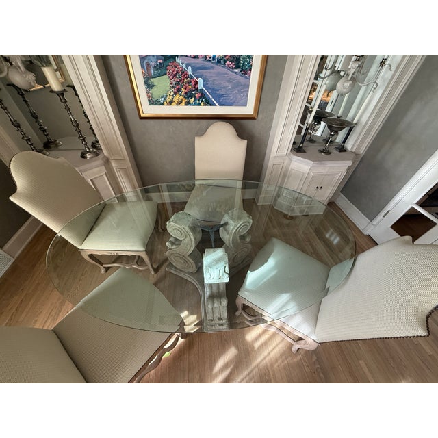 Key Features: • Four custom upholstered Guy Chaddock dining chairs • Elegant cast-stone pedestal base • Large 78” × 48”...