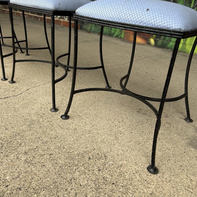 Set of 4 iron outdoor patio chairs by Salterini with blue patterned seat cushions. These chairs do Not have identification...
