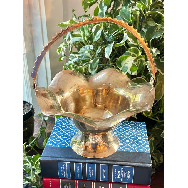 Such a versatile piece, this brass basket can be filled with your favorite collections or stand alone. It features a...