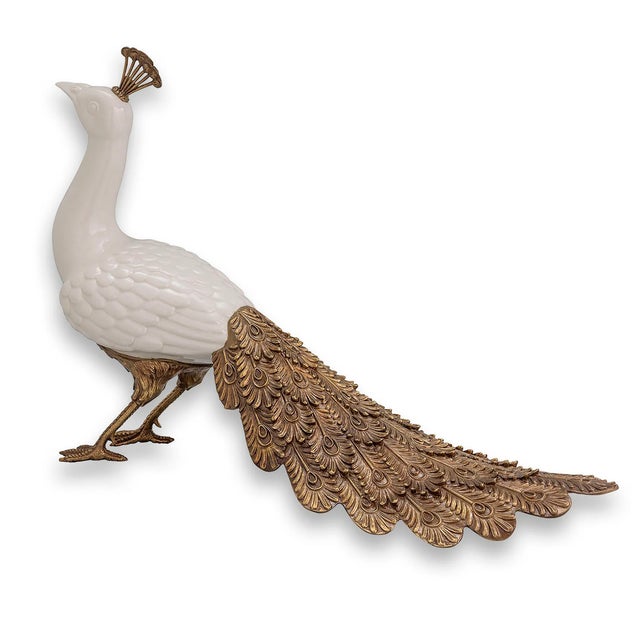 Our sculptured peacocks are majestic and grand in their style and size. The glazed porcelain bodies are accented with...