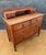 Charming chest of drawers crafted in oak, featuring a practical and elegant layout with two small upper drawers set into a...