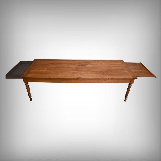 This cherrywood farmhouse table, an authentic piece from the Louis-Philippe era, showcases the nobility of its patinated...
