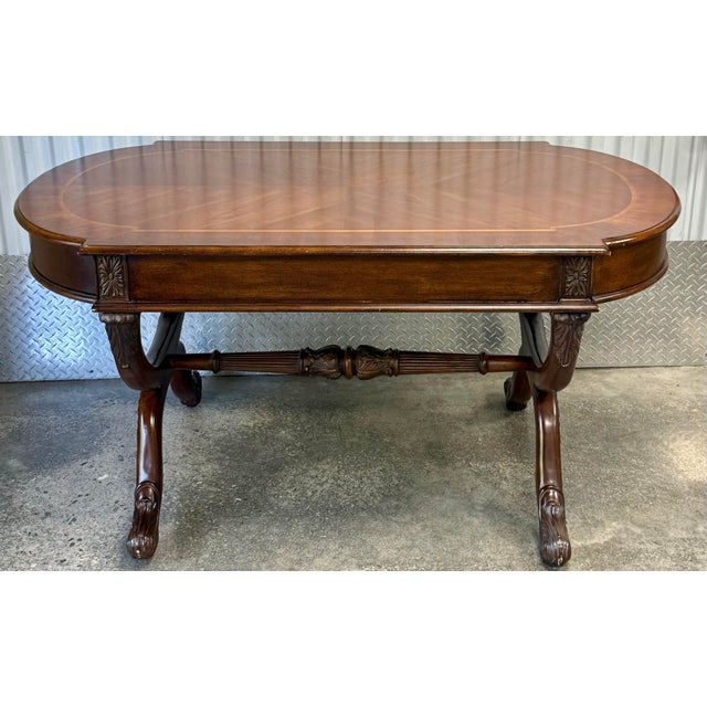 Stately George IV inspired Mahogany Writing Table. Features a tablet-shaped top with banded inlay and drop keyboard...