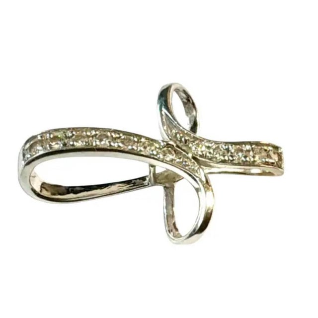 Vintage 14K White Gold and Diamond Cross Pendant featuring a fluid, sculptural twist design. The openwork cross is formed...
