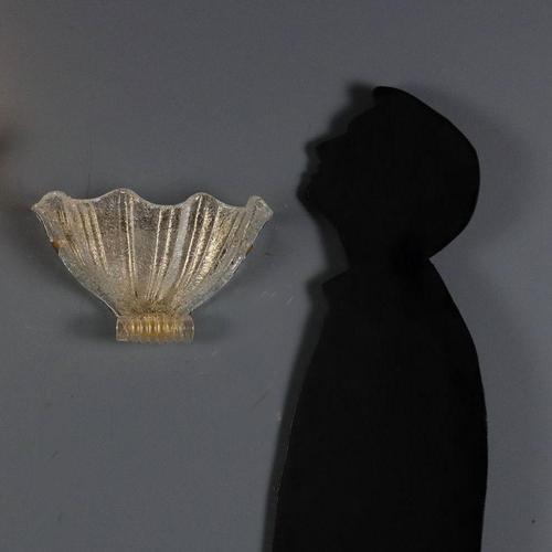 Gold Murano glass wall lamp in the shape of a shell. This piece is attributed to the mentioned designer/maker. It has no...