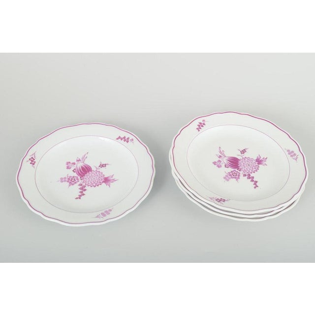 Meissen, Germany 4 lunch plates, 1930s. Set of four hand-painted porcelain lunch plates decorated with lilac floral...