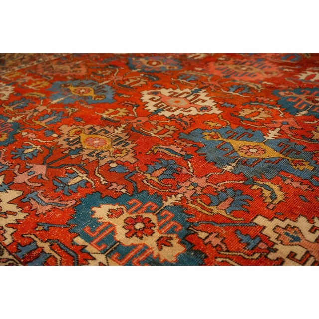 This late 19th-century Serapi rug is a premier example of Northwest Persian weaving, featuring an architectural medallion...