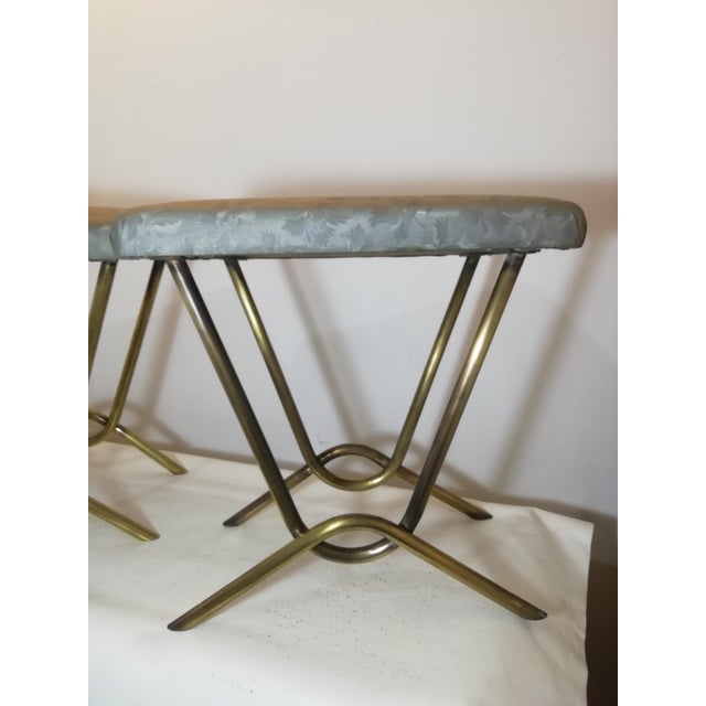 An elegant pair of original Italian stools from the 1950s, featuring a refined brass frame with an unusual sculptural...