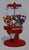 Gumball Machine by Suzy Smith | Oil Painting of a red gumball machine filled with colorful gumballs For Sale