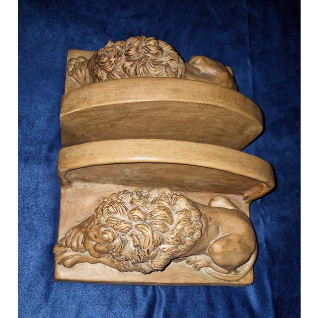 These reclining Neoclassical-style lion bookends—modeled after Antonio Canova's famous monument lions—feature a detailed...