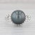 Gemstone Information: - Cultured Pearl - Size - 11.2 mm Cut - Round Shape Color - Black / Gray - Natural Diamonds - Total...