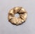 Mid 1950s to early 1960s goldtone textured overlapping leaves wreath brooch with security clasp. Marked "NAPIER©" on the...