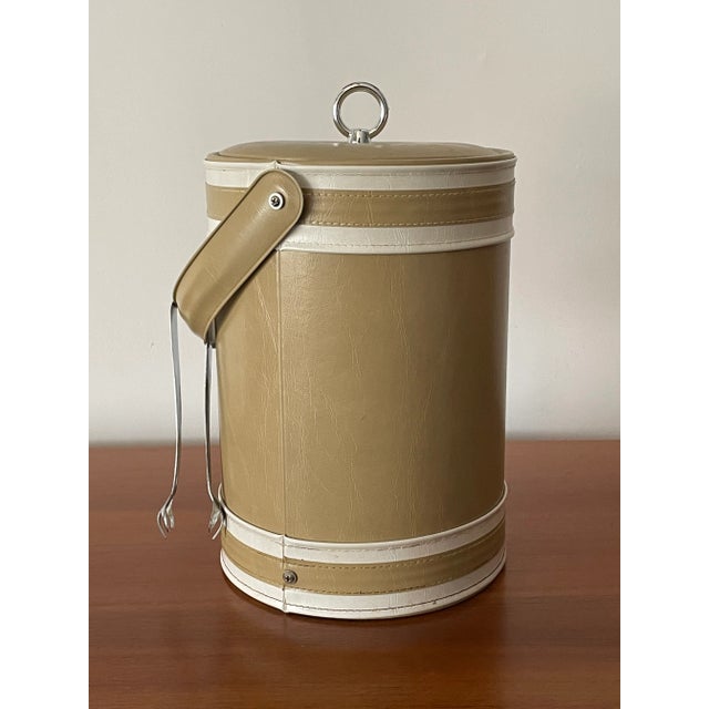 Unique faux leather ice bucket by Georges Briard. Very good original condition and ready for use.
