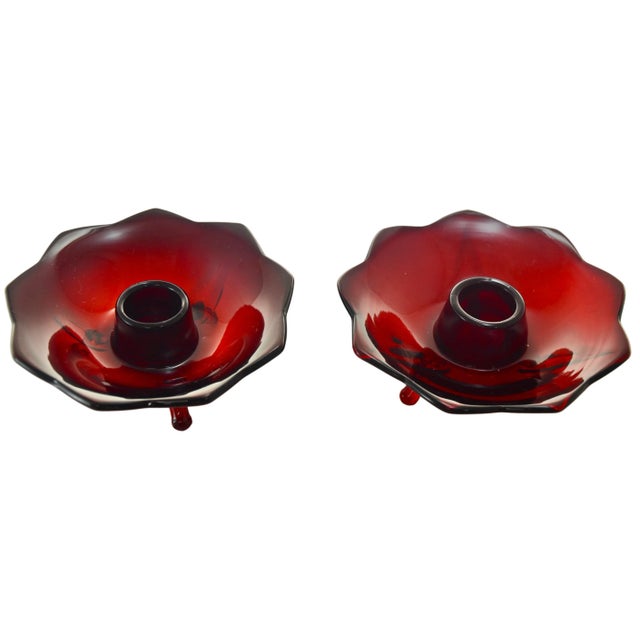 Pair of vintage ruby red glass footed taper candle holders with a lotus petal design. Simply a beautiful vintage addition...