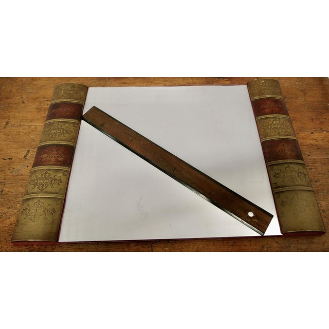 A Large Desk Blotter A great piece of desk furniture, the blotter has simulated book spines in gilt and burgundy leather,...