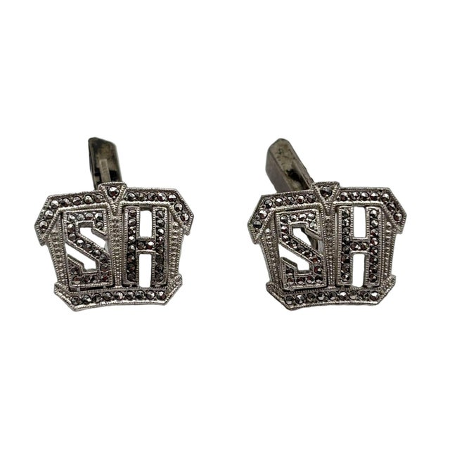 These elegant vintage cufflinks are crafted in solid sterling silver and feature a classic monogrammed design with the...