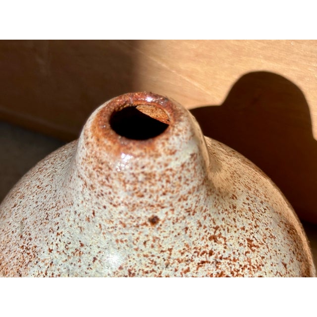 Hand-thrown vase by the German ceramicist Helma Klett (1908-1996), crafted with a warm, speckled, translucent beige glaze...