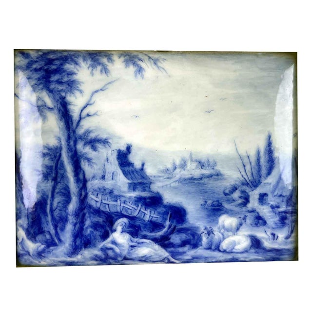 A pair of enamel plaques with figures and gilded frames of Nordic and likely French origin, executed on an enameled metal...