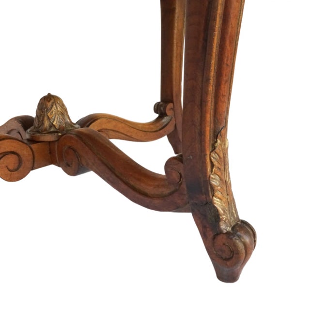 A beautifully carved early 19th-century French Louis XV tabouret (stool) featuring an intricately shaped apron with floral...