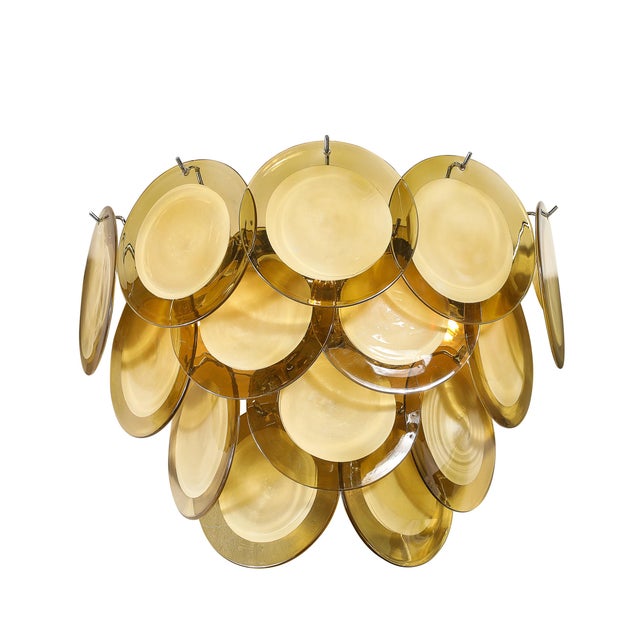 This beautifully colored Pair of Modernist 14-Disc Sconces in Hand-Blown Murano Topaz Glass with chromed fittings...
