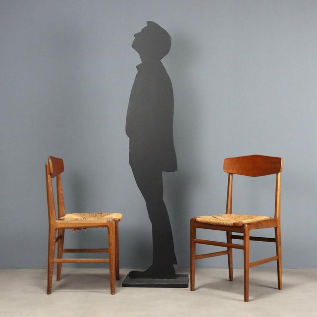 Pair of vintage chairs with beech wood frame, curved plywood backrest and rope seat. This piece is attributed to the...