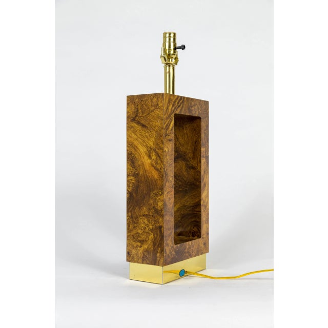 A 1970's chunky, open rectangular shaped table lamp in sleek finished faux bois Formica and brass. Newly wired. 22" height...