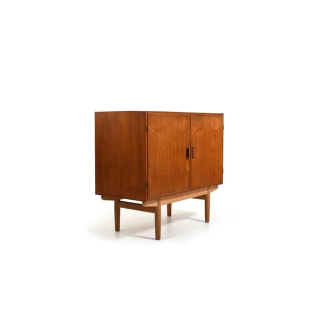 Cabinet in Teak by Børge Mogensen for Søborg Furniture 1950s. Base in solid oak. Beautiful Wood Color. I have official...