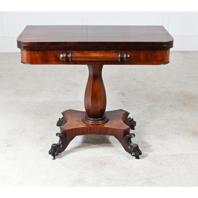 Fine pair of Victorian mahogany card tables Rectangular fold-over tops with rounded corners and richly figured mahogany...