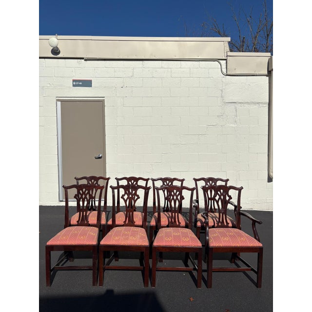 Elevate your dining space with this classic set of eight vintage Chippendale style dining chairs. Crafted in the late 20th...