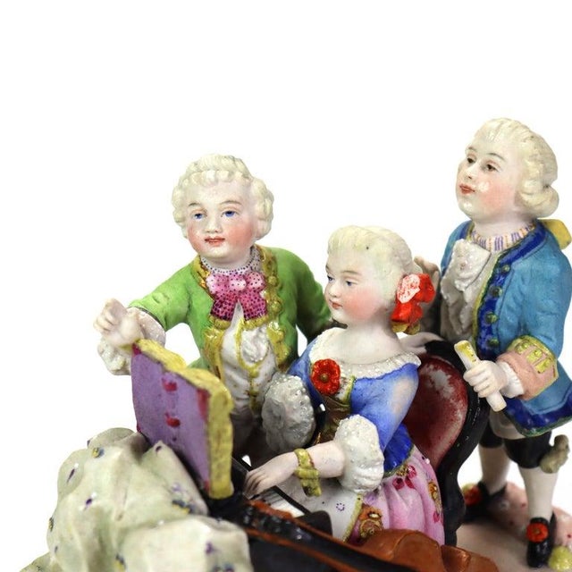 Antique Hand Painted Porcelain Musical Grouping C1890 Measures - 6"H x 7"W x 4.5"D An antique porcelain figurine depicting...