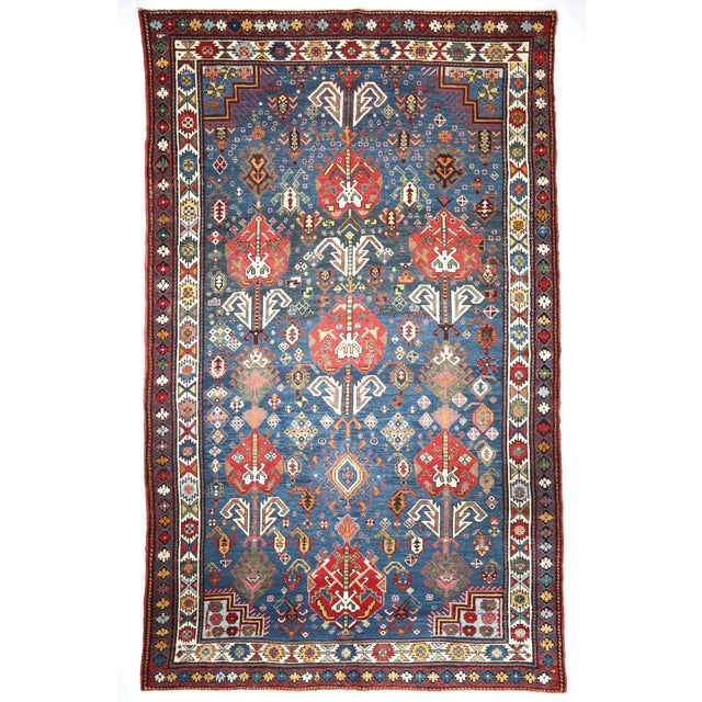 This is world class antique Baku-Shirvan from late 19th C. with splendid tones of blue. It has a wonderful design. Right...