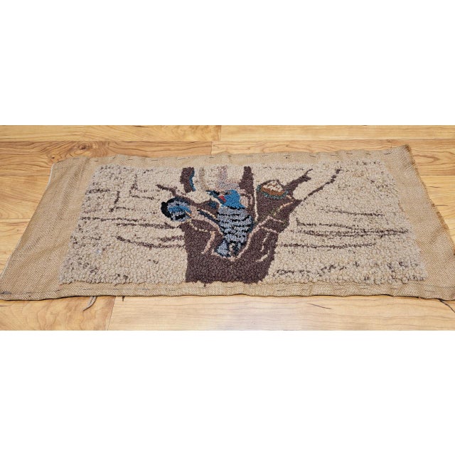 A vintage American hand-hooked rug of charming pictorial beauty and narrative warmth � a scene of two birds in a tree...