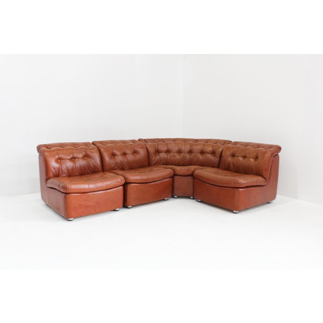 Vintage Modular Sofa from Italy in a beautiful cognac upholstery from the 1970s. This modular sofa consits of 4 modular...