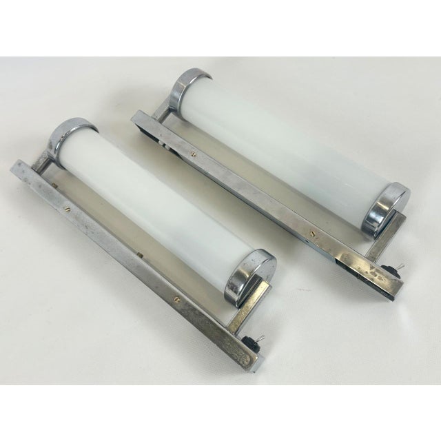 Bauhaus Chrome-Plated Tubular Wall Lamps, 1930s, Set of 2, in Good conditions. Designed 1920 to 1949 This piece has an...