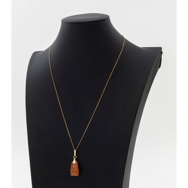 14K Rose Gold Baltic Amber Pendant Necklace, featuring one non-detachable amber pendant approx. 12.50 carats, worn on fine...